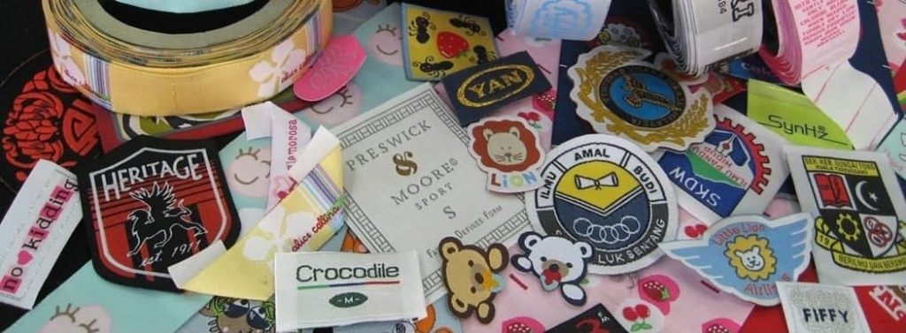 many different designs of clothing labels, badges and tags